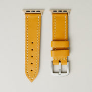 Amber full-grain leather watch strap with rose gold stainless steel adapters and silver buckle, featuring handmade stitching and matching loops. Markore Hour Line.