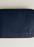 Front view of full-grain leather bifold wallet with hand-stitched red thread in Dark Blue and embossed logo. Markore Hunza Arc.