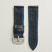 Back view of Midnight Black leather strap with stainless steel buckle, showing blue stitching, embossed logo, and serial number. Markore Hour Line.