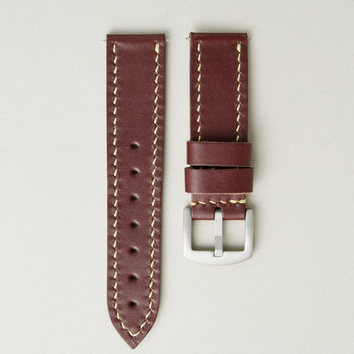 Espresso brown full-grain leather watch strap with ivory stitching, matching leather loops, and stainless steel buckle. Markore Hour Line.