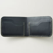 Interior view of obsidian black croc-embossed full-grain leather bifold wallet featuring ivory handmade stitching and card slots. Markore Indus Sultan