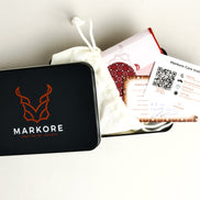 Black Markore box with branded packaging materials including certificate of authenticity