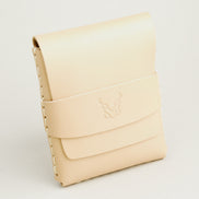 Side view of natural full-grain leather flap wallet featuring a flap holder with embossed logo, and handmade stitching. Markore Sutlej Vault.