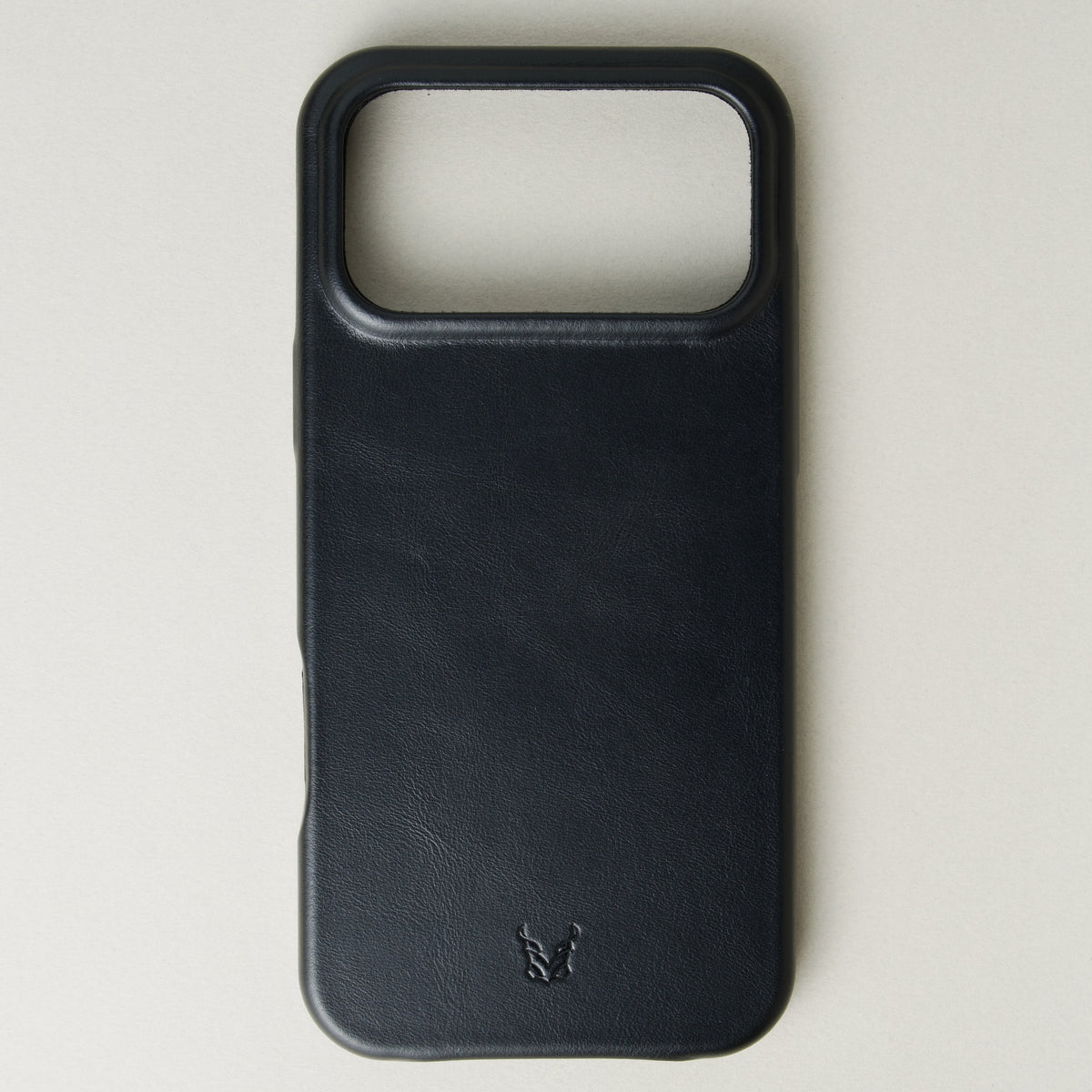 Back view of midnight black leather iphone 17 pro case with full cutout featuring embossed logo. Markore Shell Frame.
