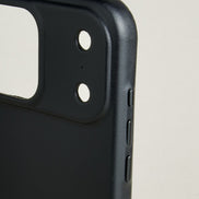 Close-up of midnight black leather iphone 17 pro case with camera cutout and side buttons. Markore Shell Guard.