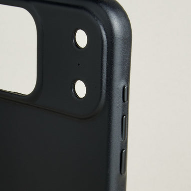 Close-up of midnight black leather iphone 17 pro case with camera cutout and side buttons. Markore Shell Guard.