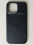 Outside view of midnight black leather iPhone 17 pro cover with full cutout featuring embossed brand logo. Markore Shell Guard.