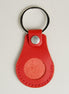 Front view of red AirTag keychain in full-grain leather with round metal key ring and stainless steel press stud. Markore Tag Mate.